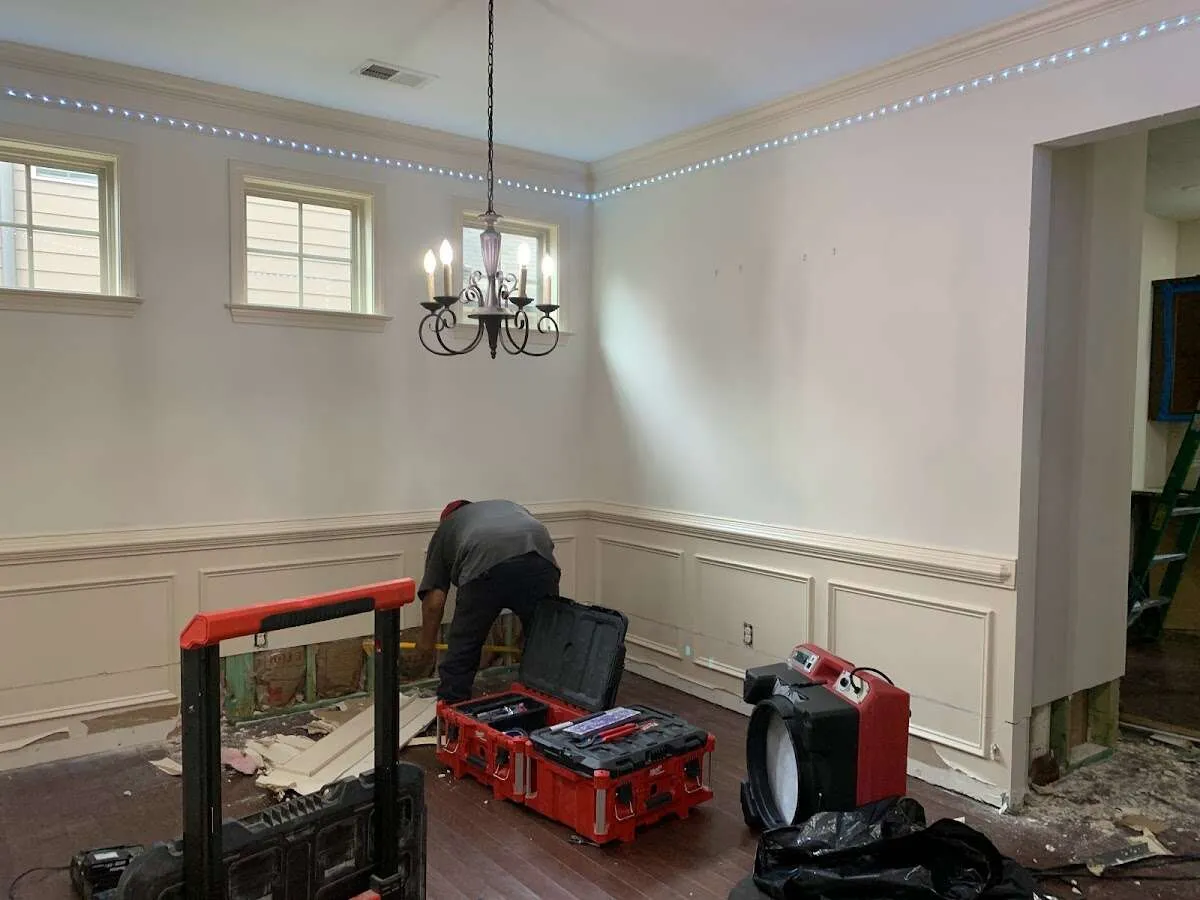 Restoration technician with professional equipment in Little Elm